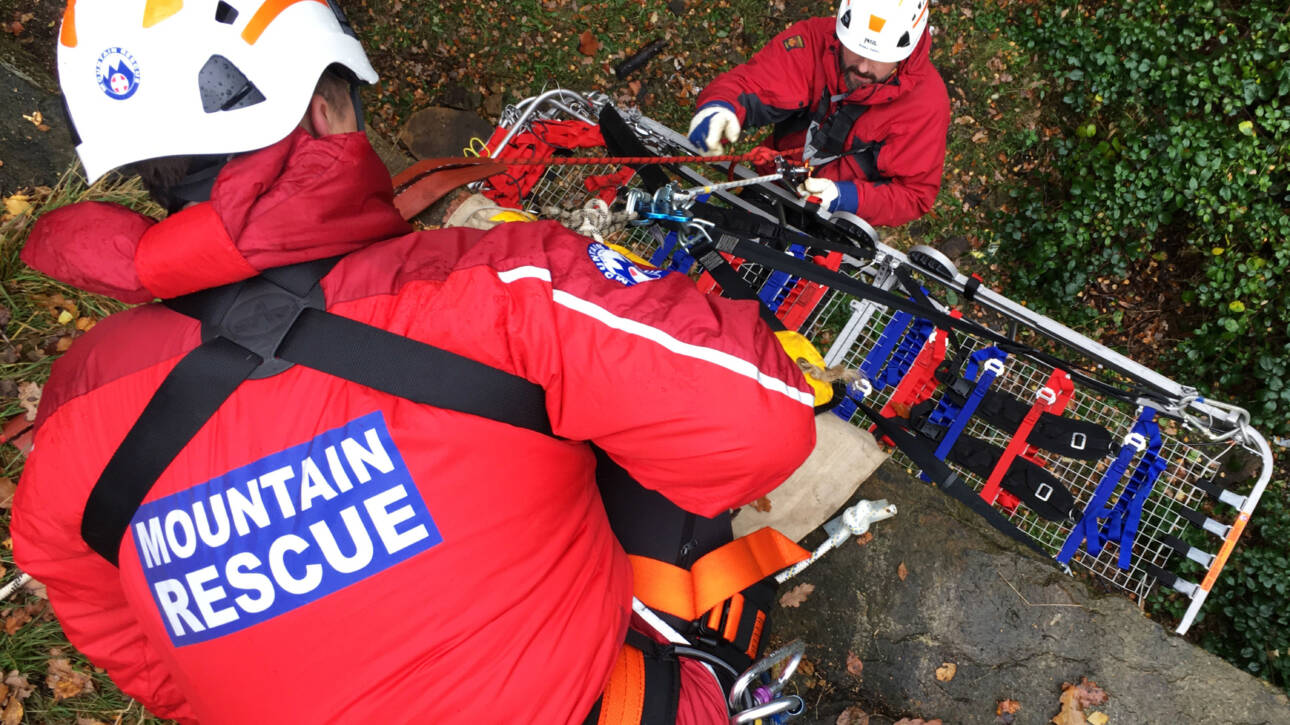 mountain rescuers ready to take action holding stretcher