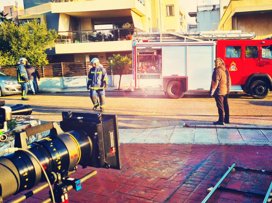 premier fire firemen crew in front of filming scene participating in cinematography